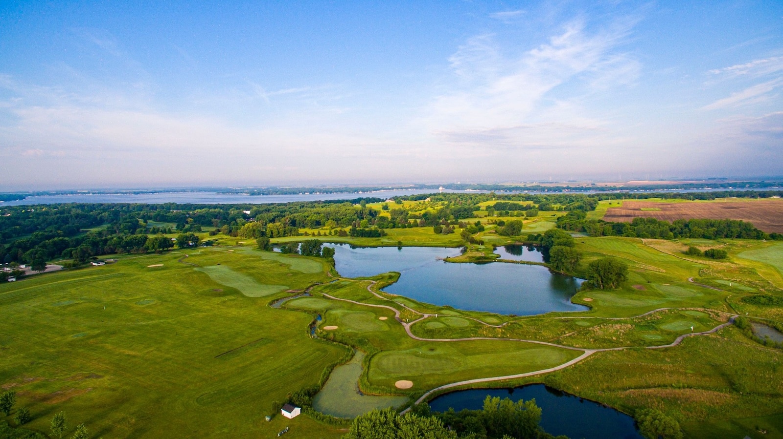 The Best Places to Visit in Iowa: Lake Okoboji 1 Pictured: Brooks Golf Course from an aerial view, one of the Best Places to Visit in Iowa